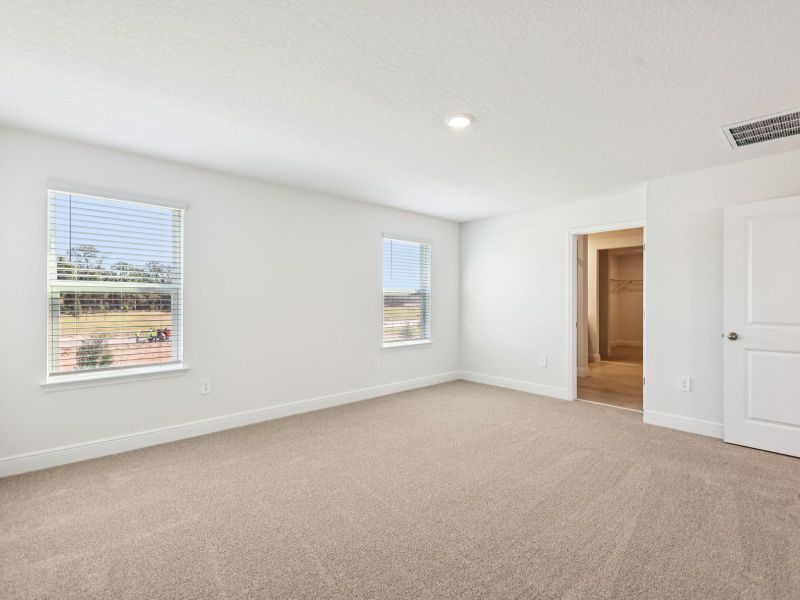 Spacious, unfurnished interior of a new home in The Reserve at Hammock Oaks - Signature Series, Lady Lake (Image 12).