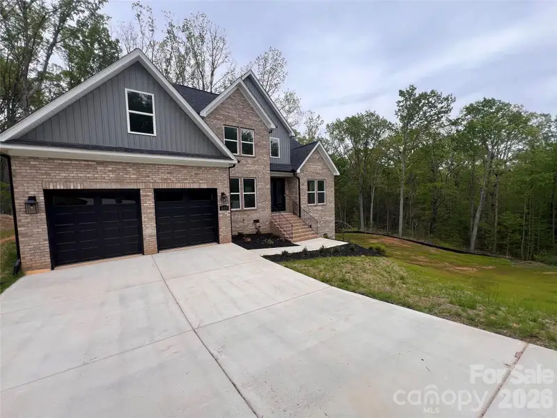 Front exterior of a new home in , Dallas, NC, highlighting curb appeal (Image 24).