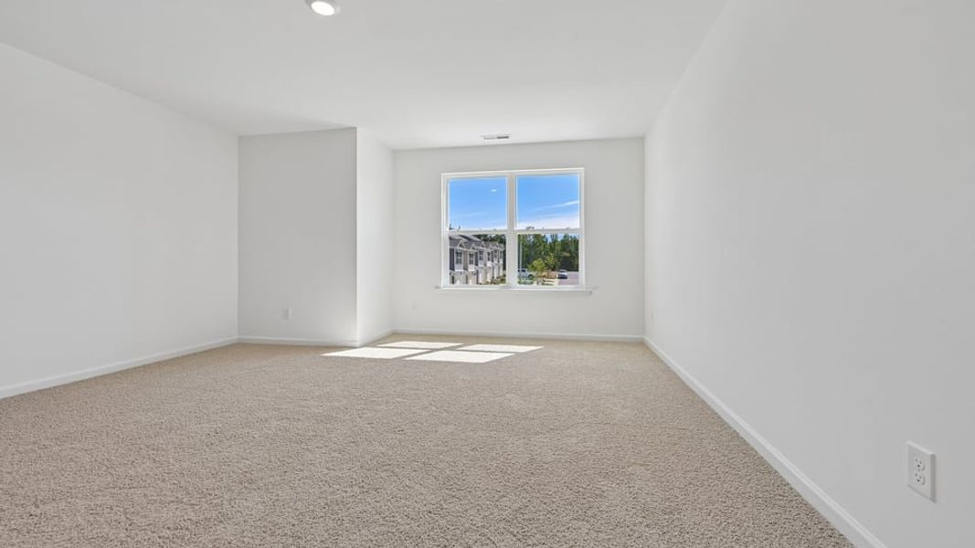 Spacious, unfurnished interior of a new home in The Townes at Belle Grove, Wendell (Image 11).