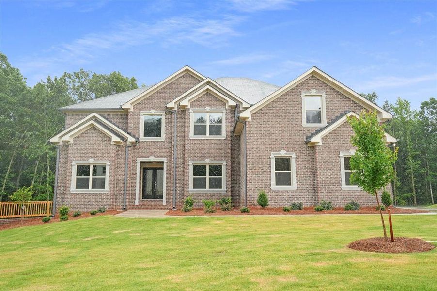 Front exterior of a new home in Underwood Crossing, Covington, GA, highlighting curb appeal (Image 1). Front exterior of a new home in Underwood Crossing, Covington, GA, highlighting curb appeal (Image 1).