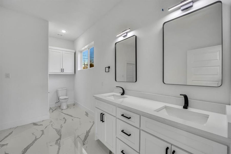 Bathroom with vanity and toilet