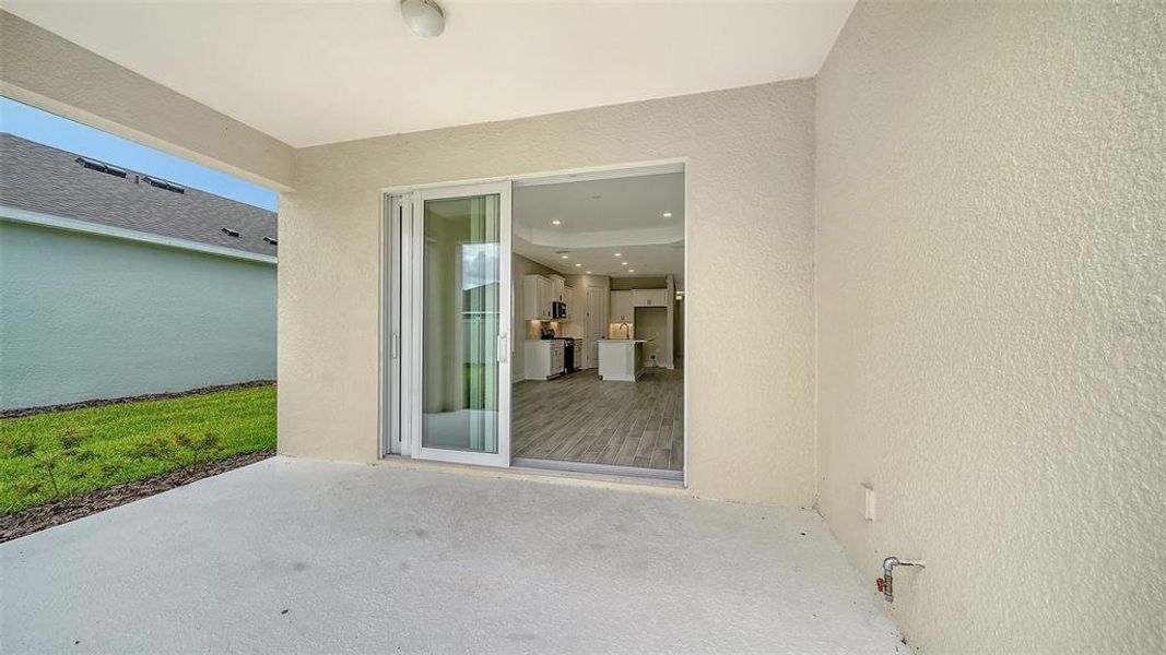 Exterior details and patio area of a home in Canoe Creek, Parrish (Image 21).