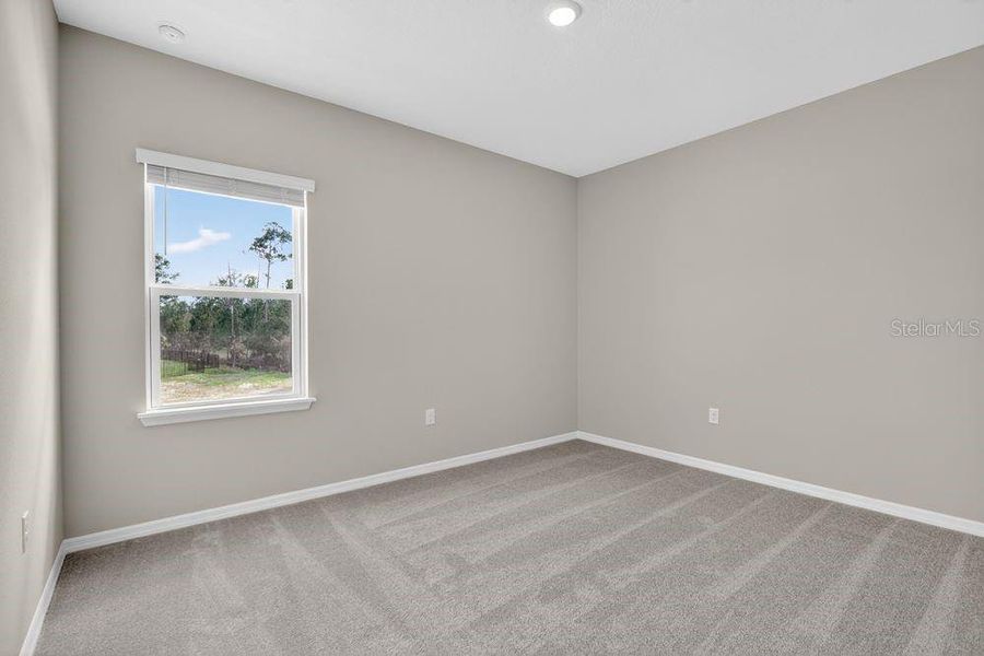 Spacious, unfurnished interior of a new home in Ardisia Park, New Smyrna Beach (Image 34).