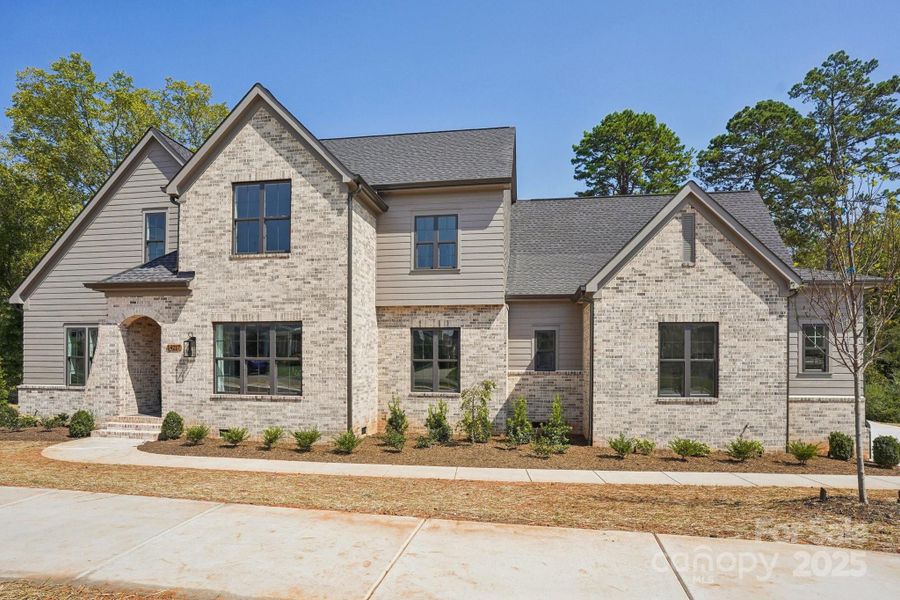 Front exterior of a new home in , Huntersville, NC, highlighting curb appeal (Image 2).