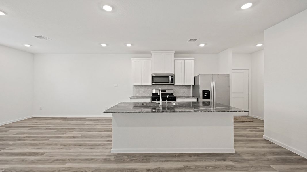 Furnished interior view inside a new home in Bridges on Lake Houston Villas, Humble (Image 3).