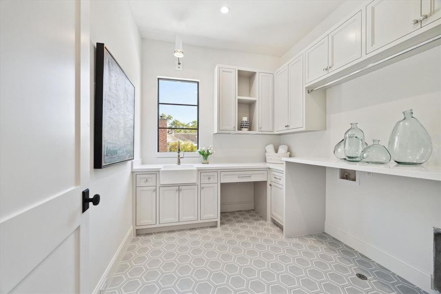 Utility Room with natural light, sink and ample storage.