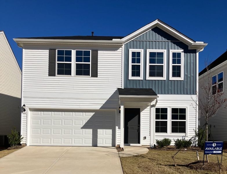 Front exterior of a new home in Braxton Place, Moore, SC, highlighting curb appeal (Image 1).