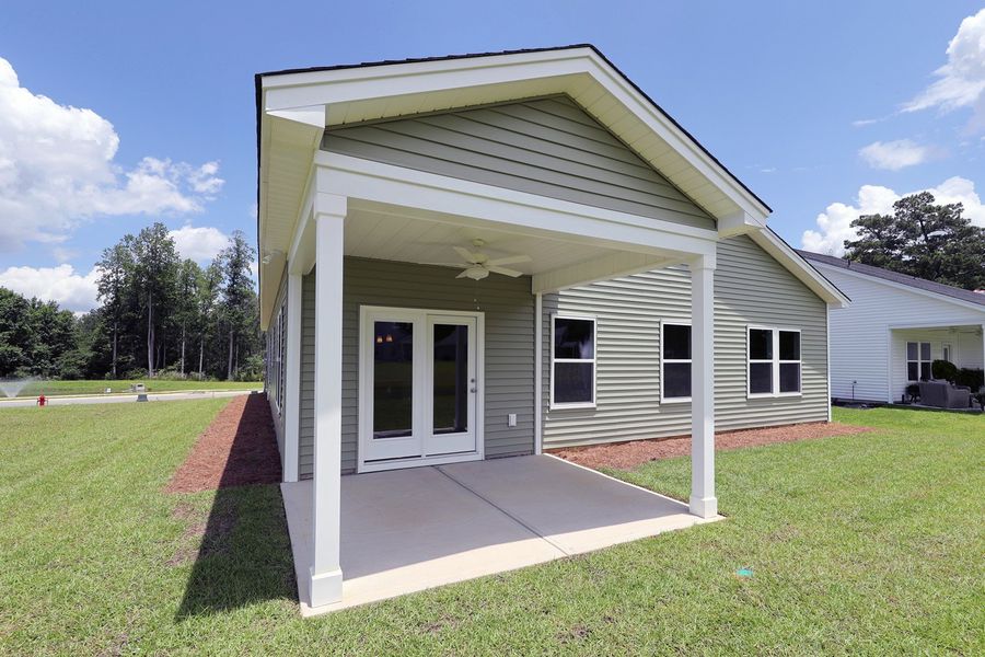 Front exterior of a new home in Jordan Grove, Conway, SC, highlighting curb appeal (Image 2). Front exterior of a new home in Jordan Grove, Conway, SC, highlighting curb appeal (Image 2).