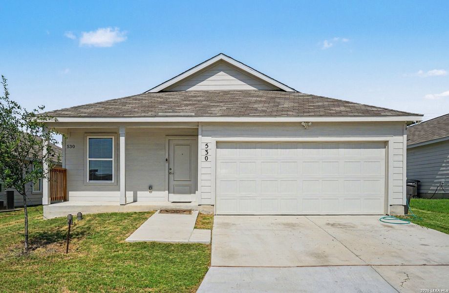 Front exterior of a new home in Tarasco Gardens, San Antonio, TX, highlighting curb appeal (Image 1). Front exterior of a new home in Tarasco Gardens, San Antonio, TX, highlighting curb appeal (Image 1).