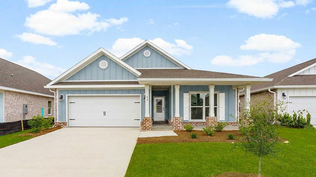Front exterior of a new home in Owl's Head Farms, Freeport, FL, highlighting curb appeal (Image 1). Front exterior of a new home in Owl's Head Farms, Freeport, FL, highlighting curb appeal (Image 1).