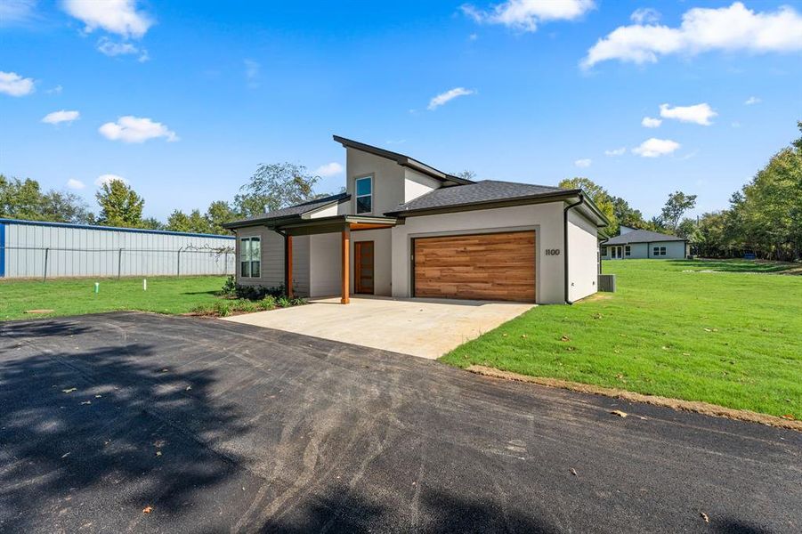 Front exterior of a new home in , Lindale, TX, highlighting curb appeal (Image 17).