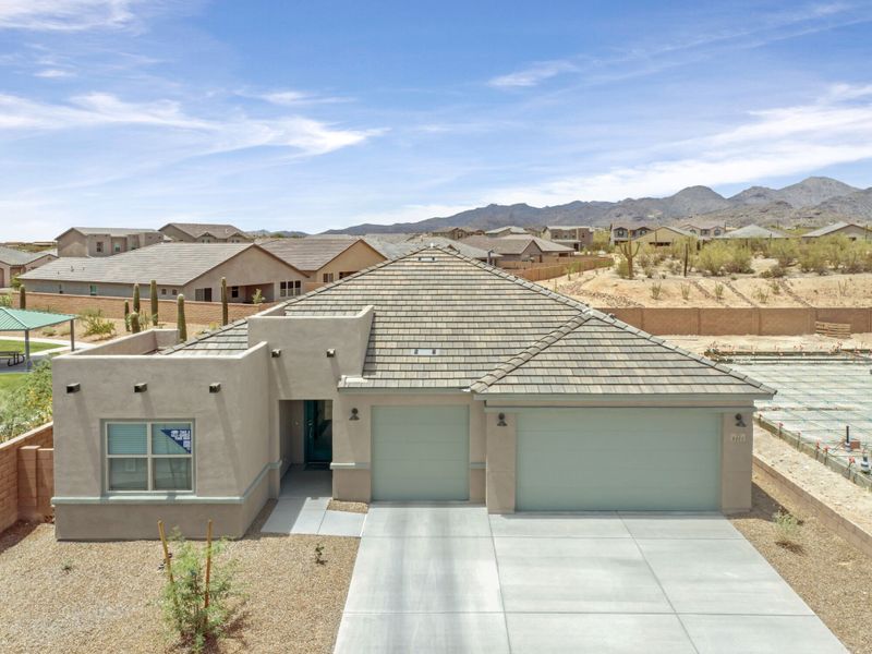 Front exterior of a new home in Montelena, Marana, AZ, highlighting curb appeal (Image 2). Front exterior of a new home in Montelena, Marana, AZ, highlighting curb appeal (Image 2).