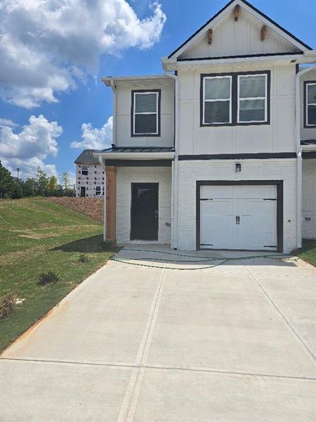 Front exterior of a new home in The Grove At Mundy Mill, Gainesville, GA, highlighting curb appeal (Image 5).