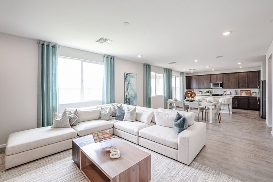 A living room with a couch and a table. A living room with a couch and a table.