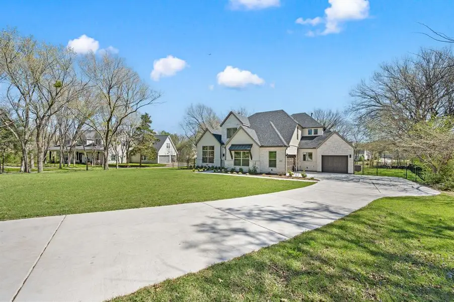 Front exterior of a new home in , Keller, TX, highlighting curb appeal (Image 2). Front exterior of a new home in , Keller, TX, highlighting curb appeal (Image 2).