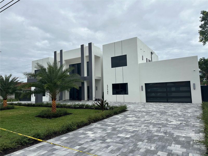 Very large driveway, with porta cochere, and beautifully finished two car garage.