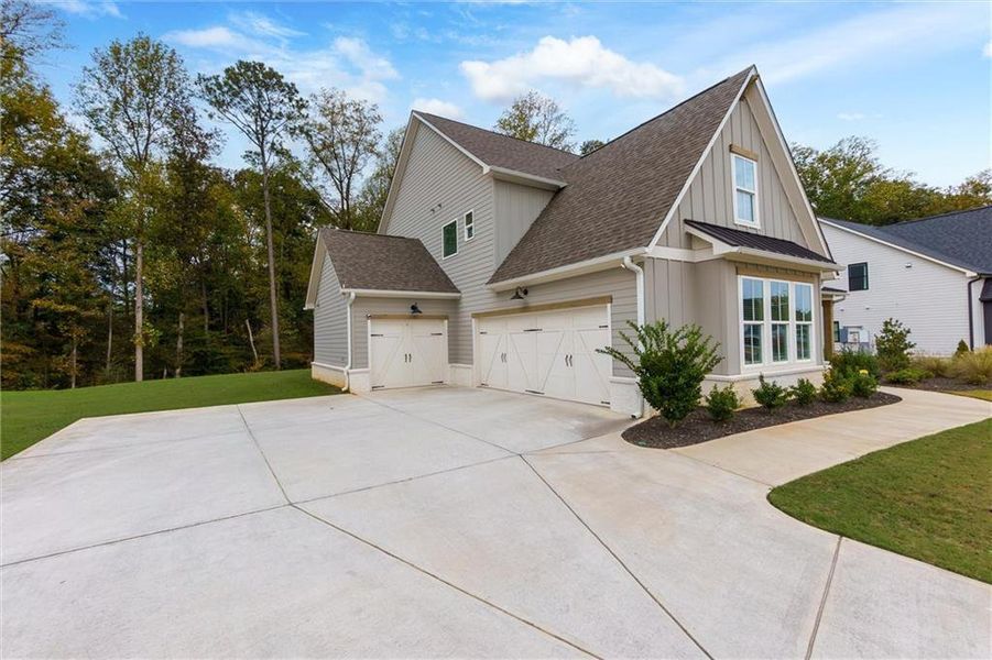 Front exterior of a new home in Fireside Farms, Gainesville, GA, highlighting curb appeal (Image 2).