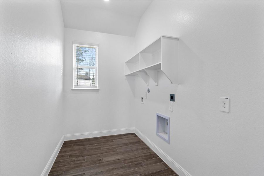 This bright and functional laundry room is conveniently located and ready for your appliances. It features clean white walls, trim, shelves, gorgeous tile flooring and a convenient window with blinds. This bright and functional laundry room is conveniently located and ready for your appliances. It features clean white walls, trim, shelves, gorgeous tile flooring and a convenient window with blinds.