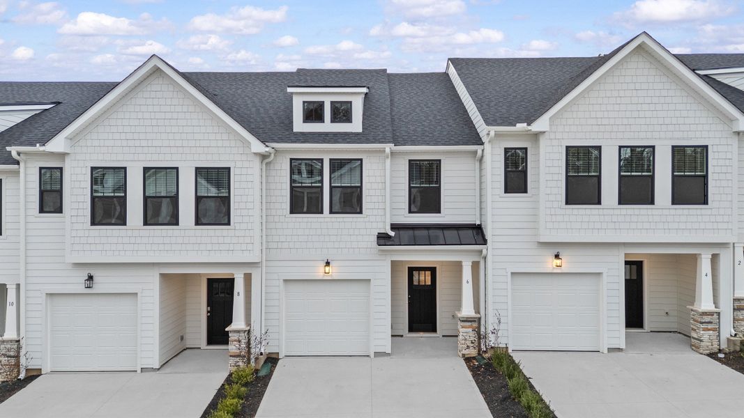 Front exterior of a new home in Gresham Station, Simpsonville, SC, highlighting curb appeal (Image 2). Front exterior of a new home in Gresham Station, Simpsonville, SC, highlighting curb appeal (Image 2).