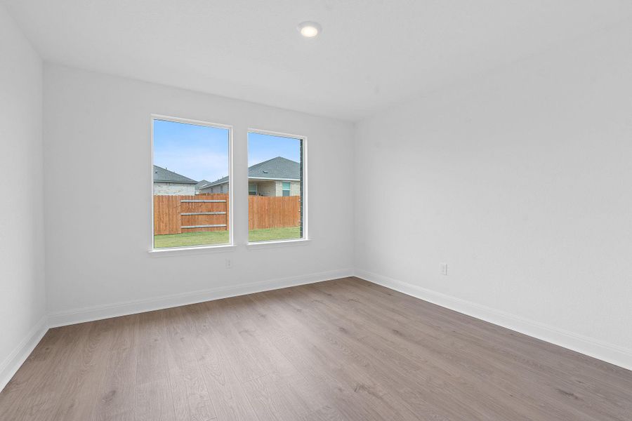 Unfurnished room with light wood-style flooring and recessed lighting Unfurnished room with light wood-style flooring and recessed lighting