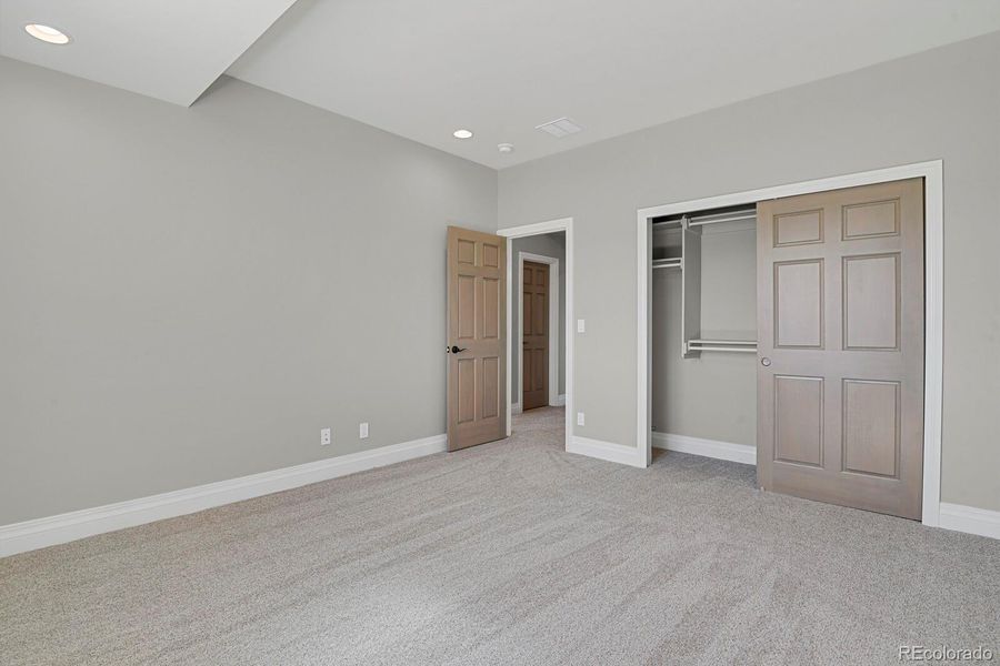 Bedroom #4 entry and closet with built-in shelves