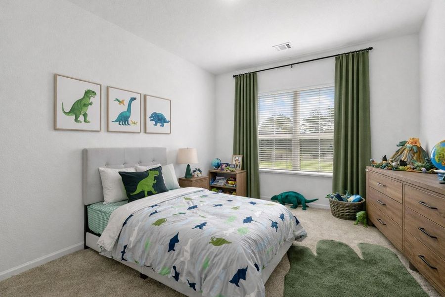 Charming bedroom with staged with playful theme, bright window, and ample space for creativity. Charming bedroom with staged with playful theme, bright window, and ample space for creativity.