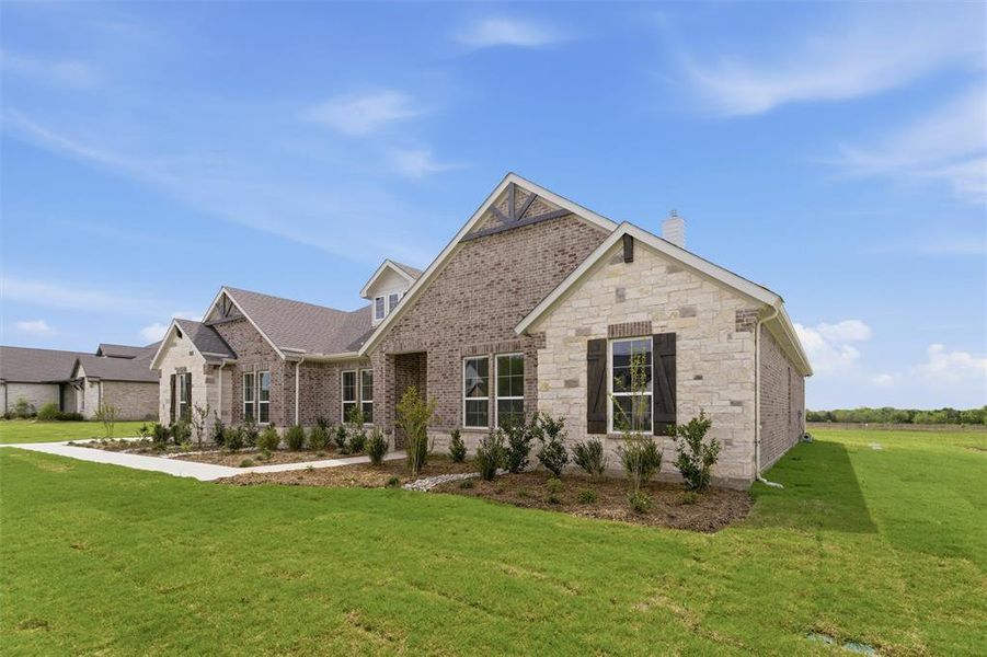 Front exterior of a new home in Fannin Ranch, Leonard, TX, highlighting curb appeal (Image 17).
