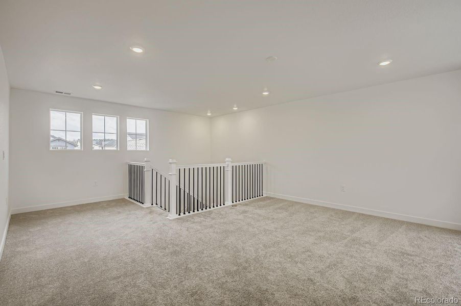 Spacious, unfurnished interior of a new home in Riano Ridge: The Grand Collection, Loveland (Image 9). Spacious, unfurnished interior of a new home in Riano Ridge: The Grand Collection, Loveland (Image 9).