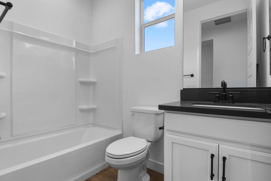 Furnished interior view inside a new home in CantaMia at Estrella 55+, Goodyear (Image 12).