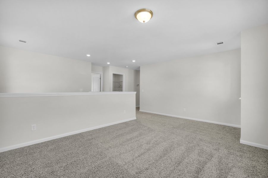 Representative unfurnished interior of a home built from the The Magnolia by Smith Family Homes in Lakeview Pines, Statesboro (Image 47).