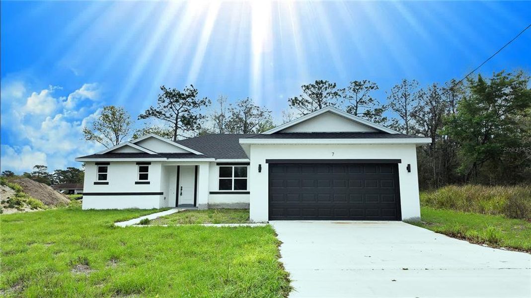 Front exterior of a new home in , Ocala, FL, highlighting curb appeal (Image 2). Front exterior of a new home in , Ocala, FL, highlighting curb appeal (Image 2).