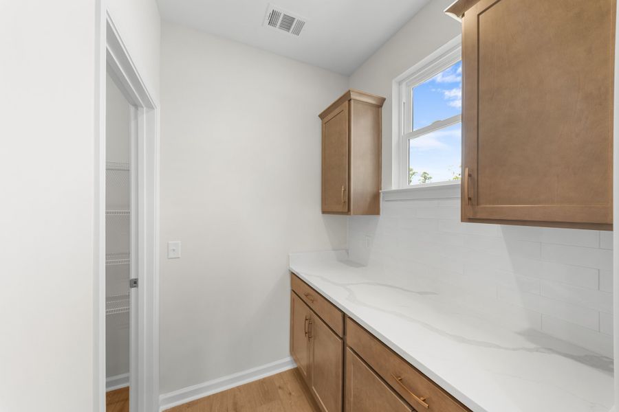 Representative furnished interior of a home built from the The Madison by Smith Family Homes in Camden Crossing, Savannah (Image 8).