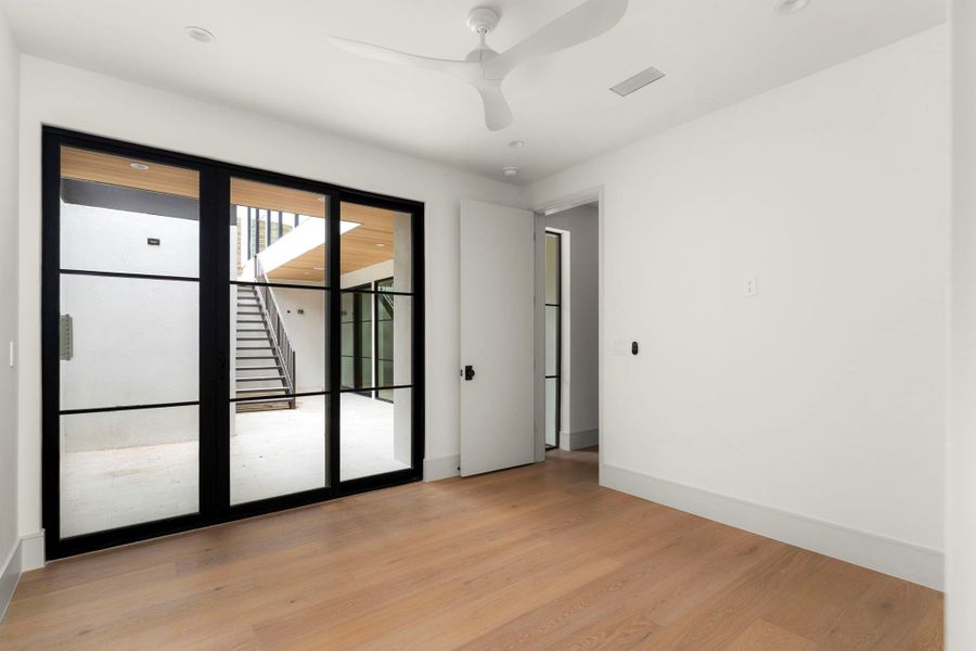 Spare room featuring light wood-style floors and ceiling fan