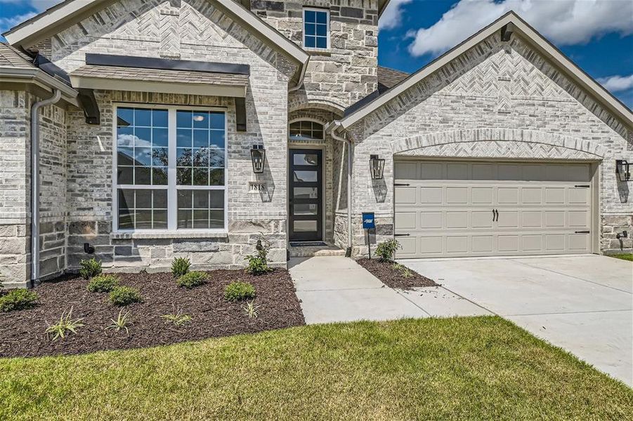 View of front of home featuring a garage