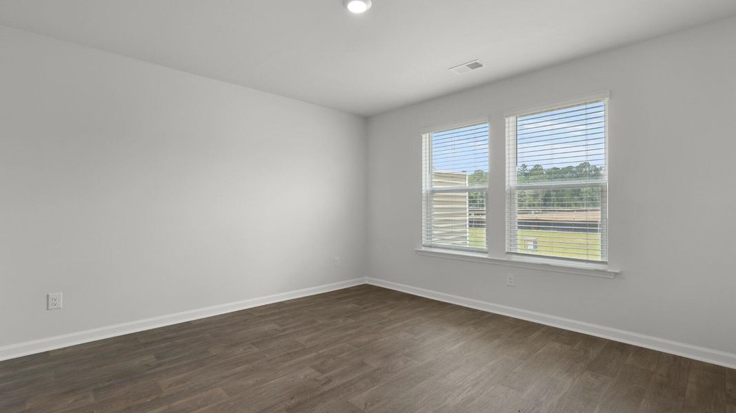 Spacious, unfurnished interior of a new home in Pine Hills Townhomes at Cane Bay, Summerville (Image 10).