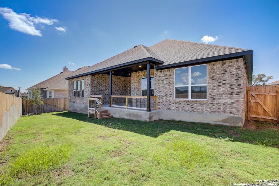 Front exterior of a new home in The Reserve at Potranco Oaks, Castroville, TX, highlighting curb appeal (Image 78).