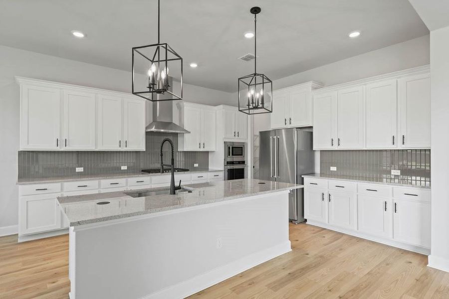 Beautiful, sleek cabinets with black iron hardware.