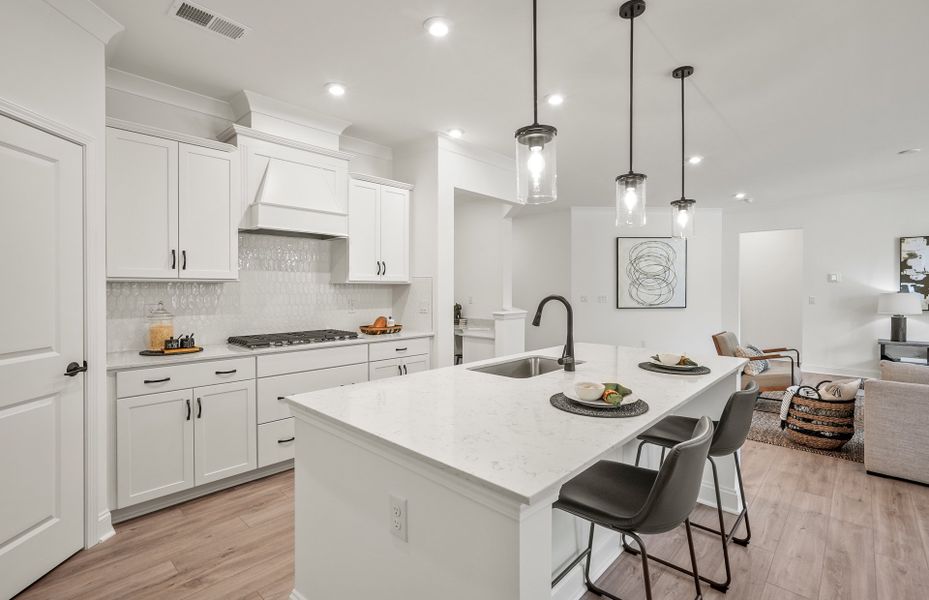 Bright Open Kitchen with Large Island and Café