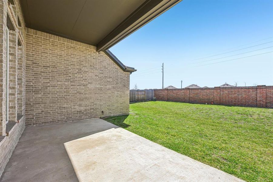 Step outside and enjoy your own private retreat! This spacious backyard features a covered patio, perfect for grilling, dining, and relaxing with family and friends.