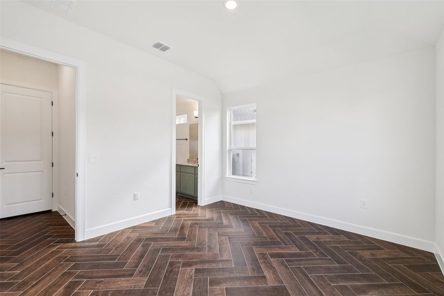 Unfurnished bedroom with recessed lighting and connected bathroom