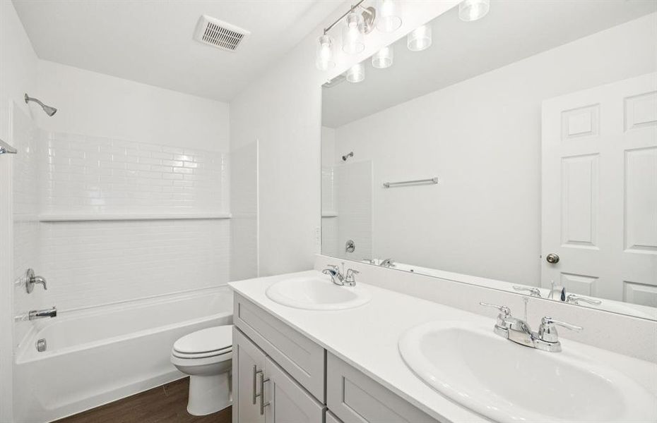 Spacious secondary bathroom with double sinks Spacious secondary bathroom with double sinks