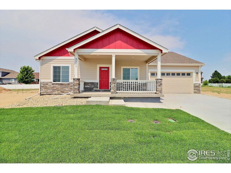 Front exterior of a new home in , Evans, CO, highlighting curb appeal (Image 1).