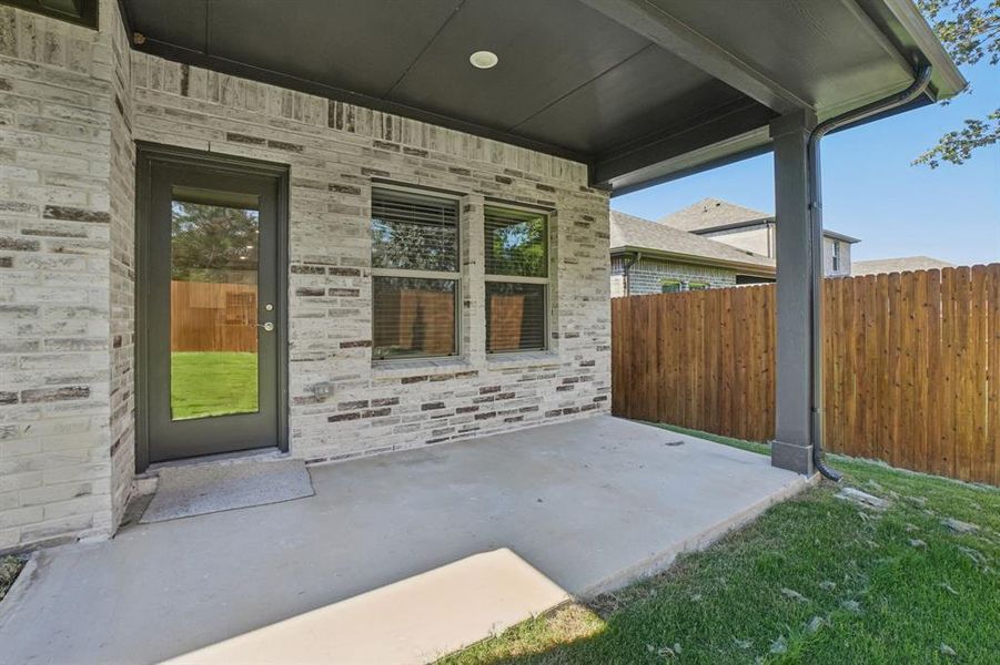 Exterior details and patio area of a home in Eastridge - Spring Series, McKinney (Image 4). Exterior details and patio area of a home in Eastridge - Spring Series, McKinney (Image 4).