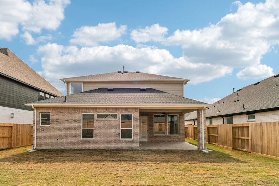 Exterior details and patio area of a home in The Highlands, Porter (Image 26).