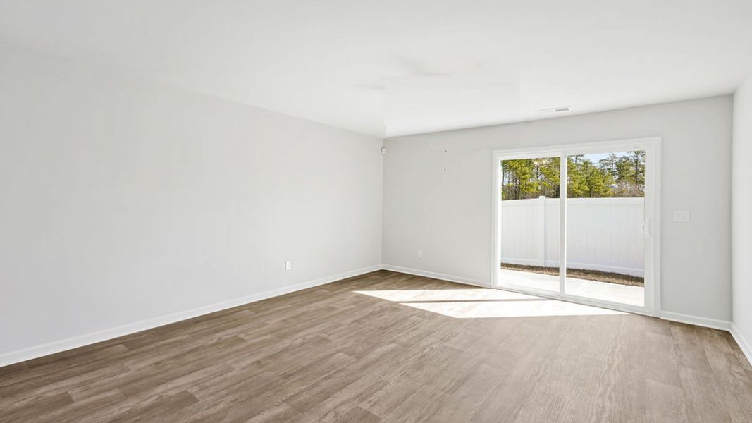Representative unfurnished interior of a home built from the BAYSHORE by D.R. Horton in Indigo Preserve Townhomes, Leland (Image 15).