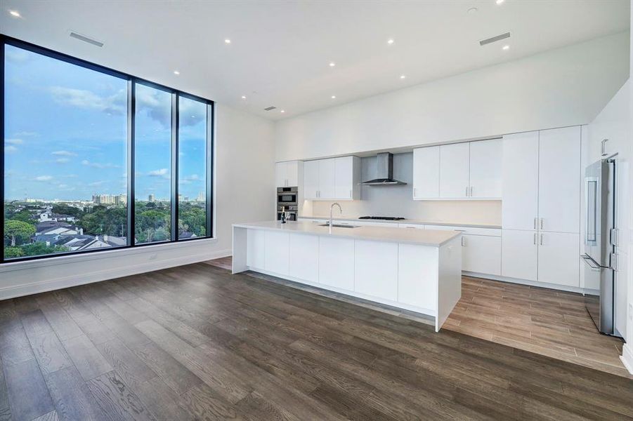 Wood-look tile flooring paves the gourmet kitchen.