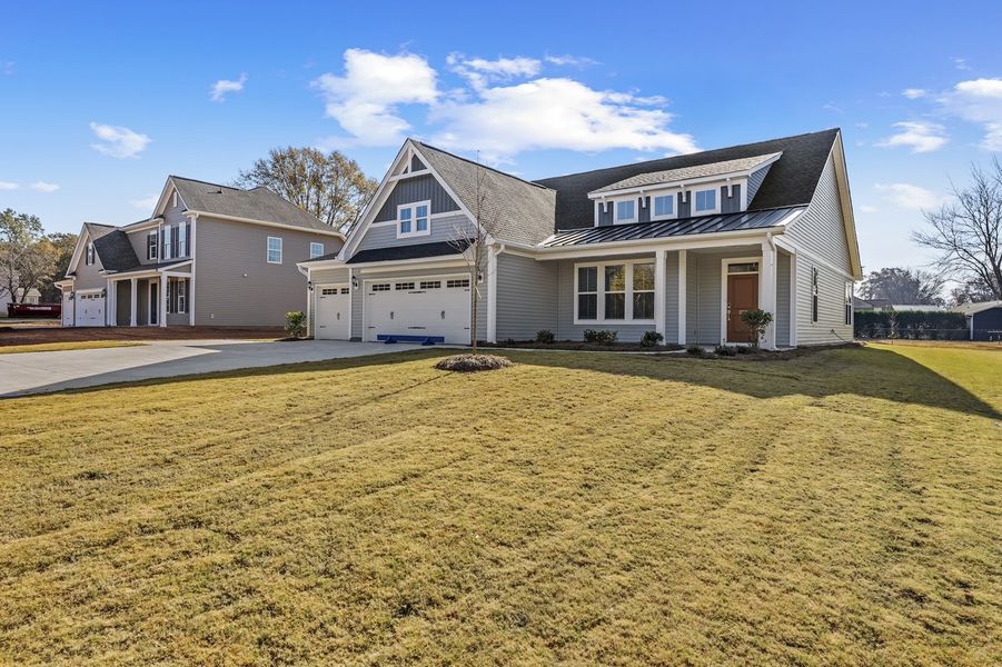 Front exterior of a new home in Windsor Forest, Anderson, SC, highlighting curb appeal (Image 18).