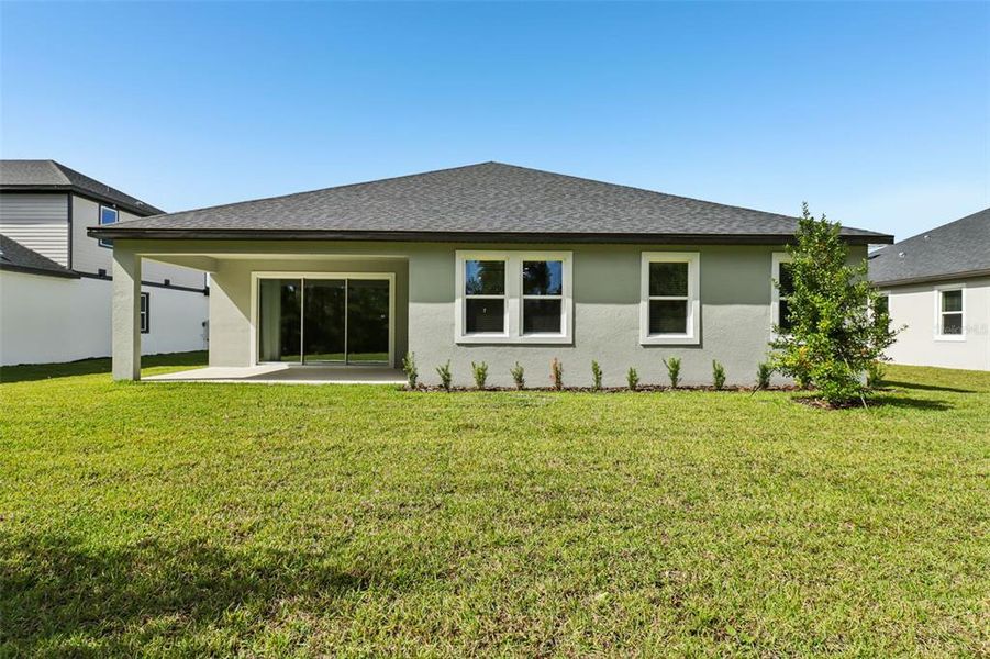 Exterior details and patio area of a home in Ridgehaven - Reserve Series, Ormond Beach (Image 22).