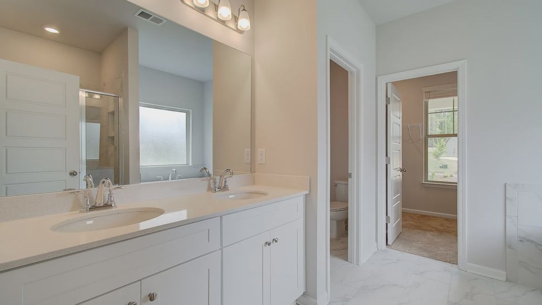 Representative furnished interior of a home built from the Meridian II by DRB Homes in Northcroft, Loganville (Image 18).