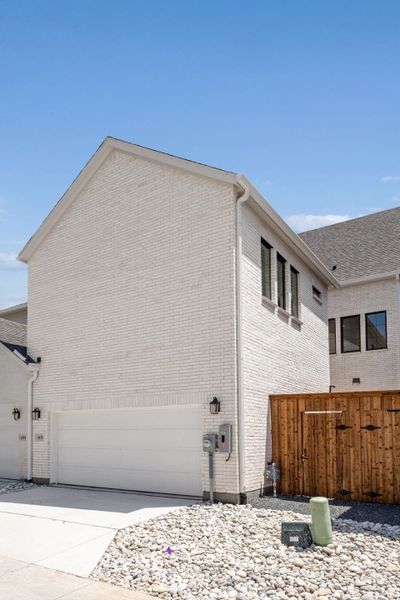 Exterior details and patio area of a home in Newman Village Townhomes, Frisco (Image 23).